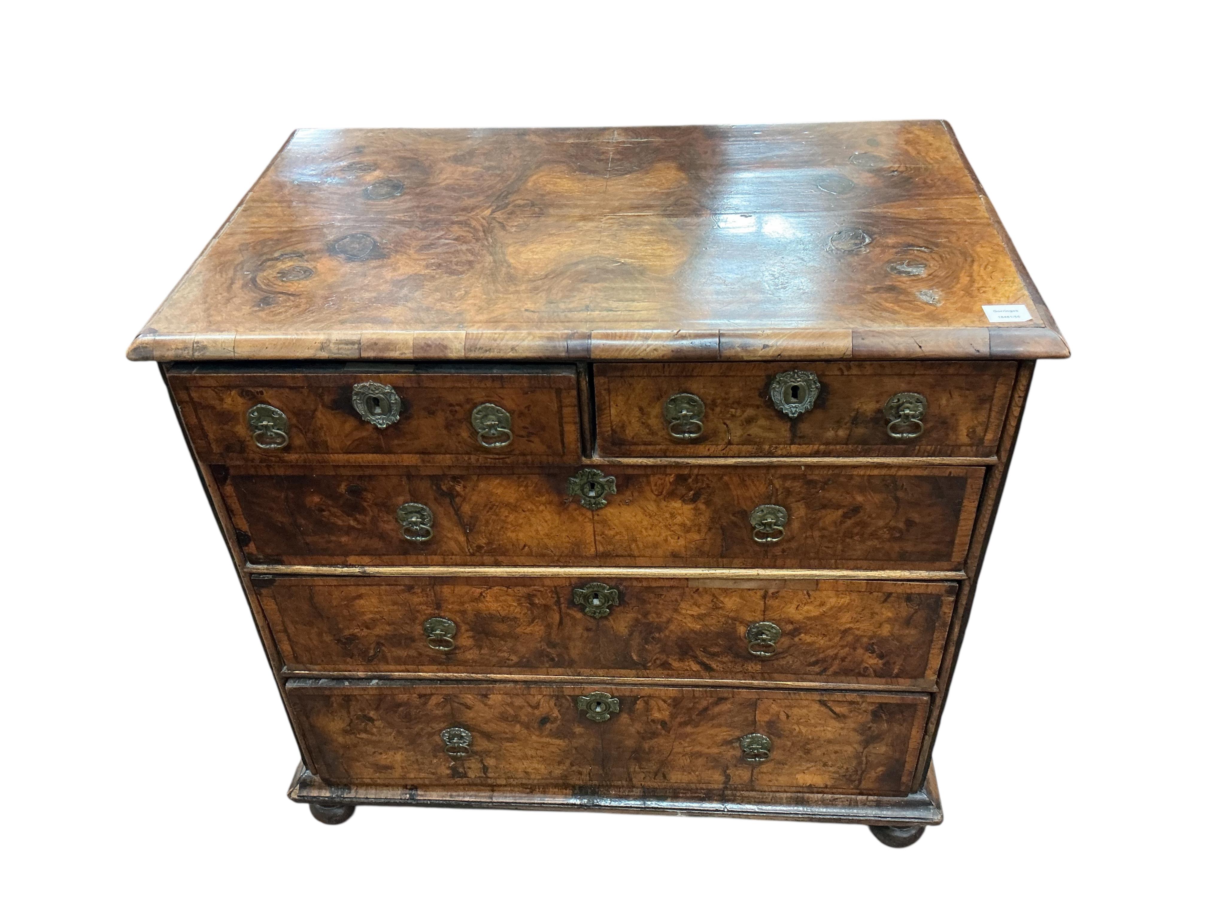A Queen Anne walnut chest, with bun feet, width 92cm, depth 55cm, height 86cm
